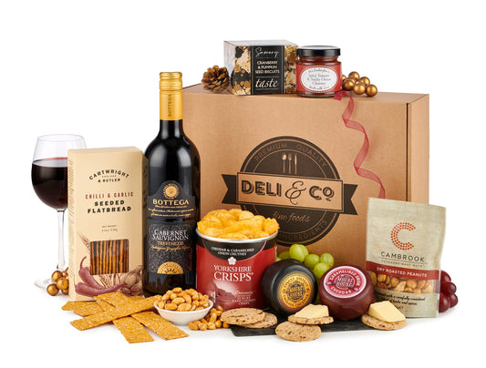 The Wine & Cheese hamper laid out on a cheeseboard.